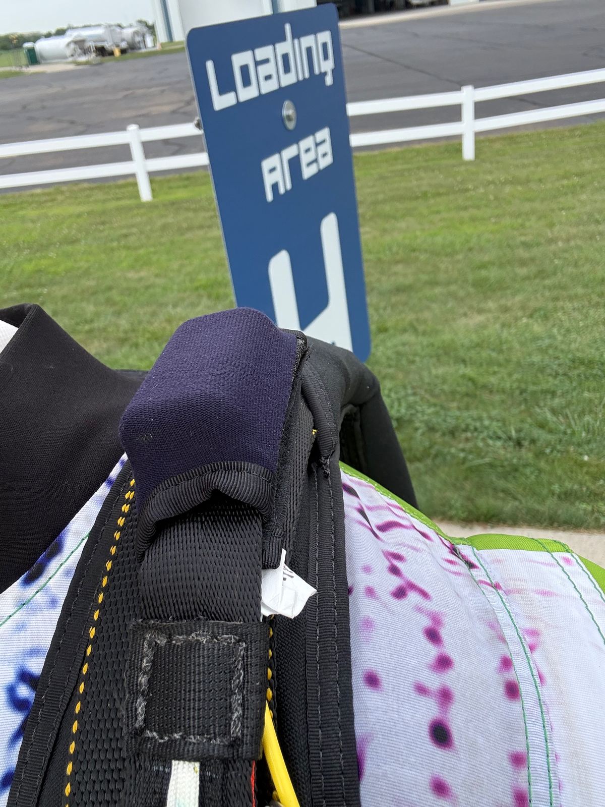 Container, harness and handles on a packed rig at the dropzone loading area